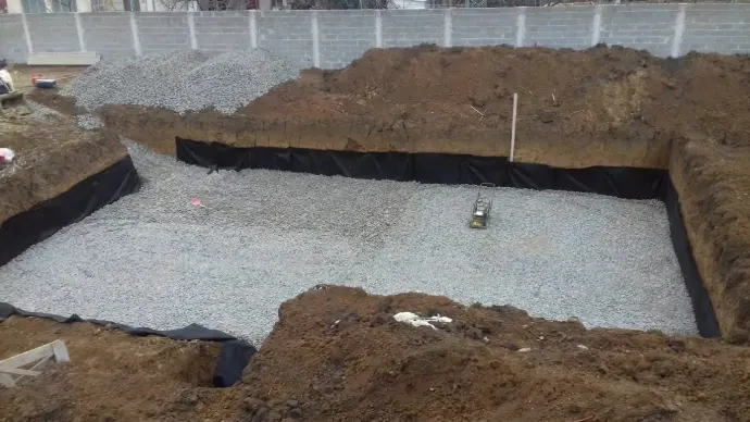 Pool excavation lined and filled with foam glass aggregate
